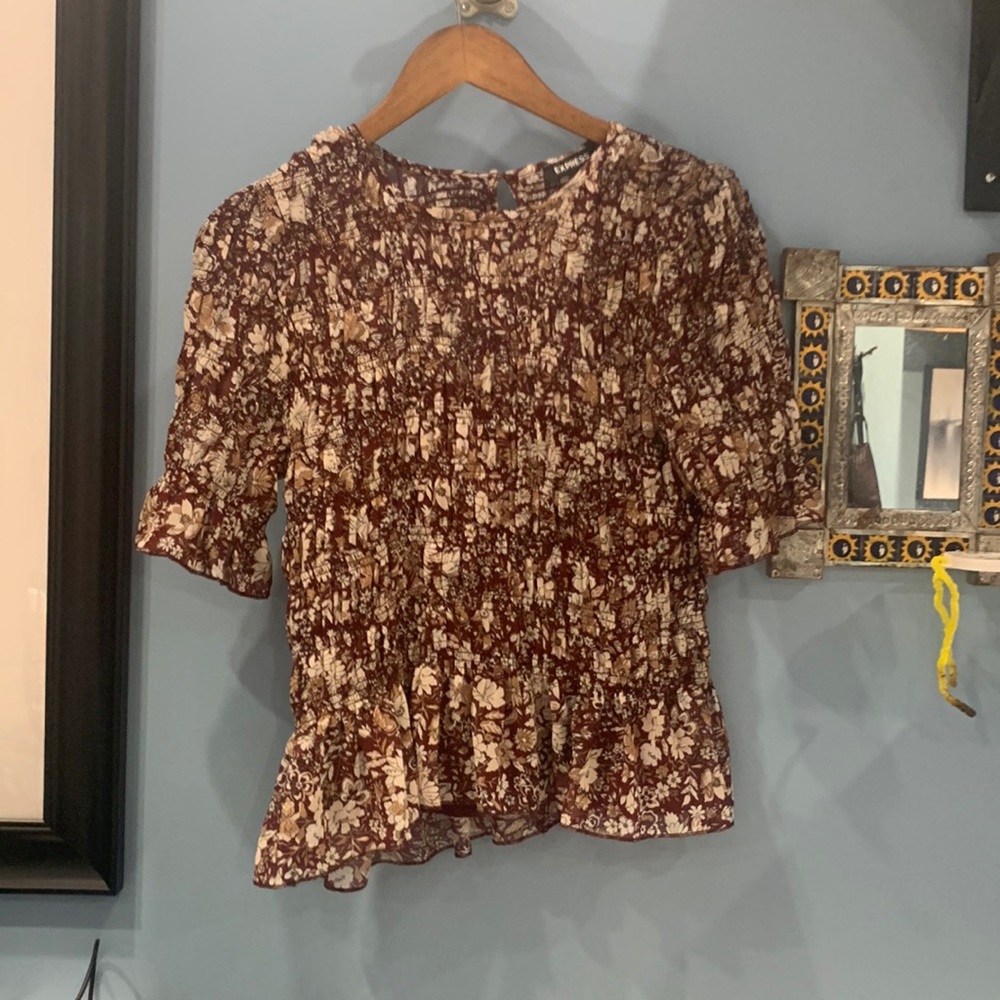 Dark red, gold, and white peplum 3/4 sleeve top